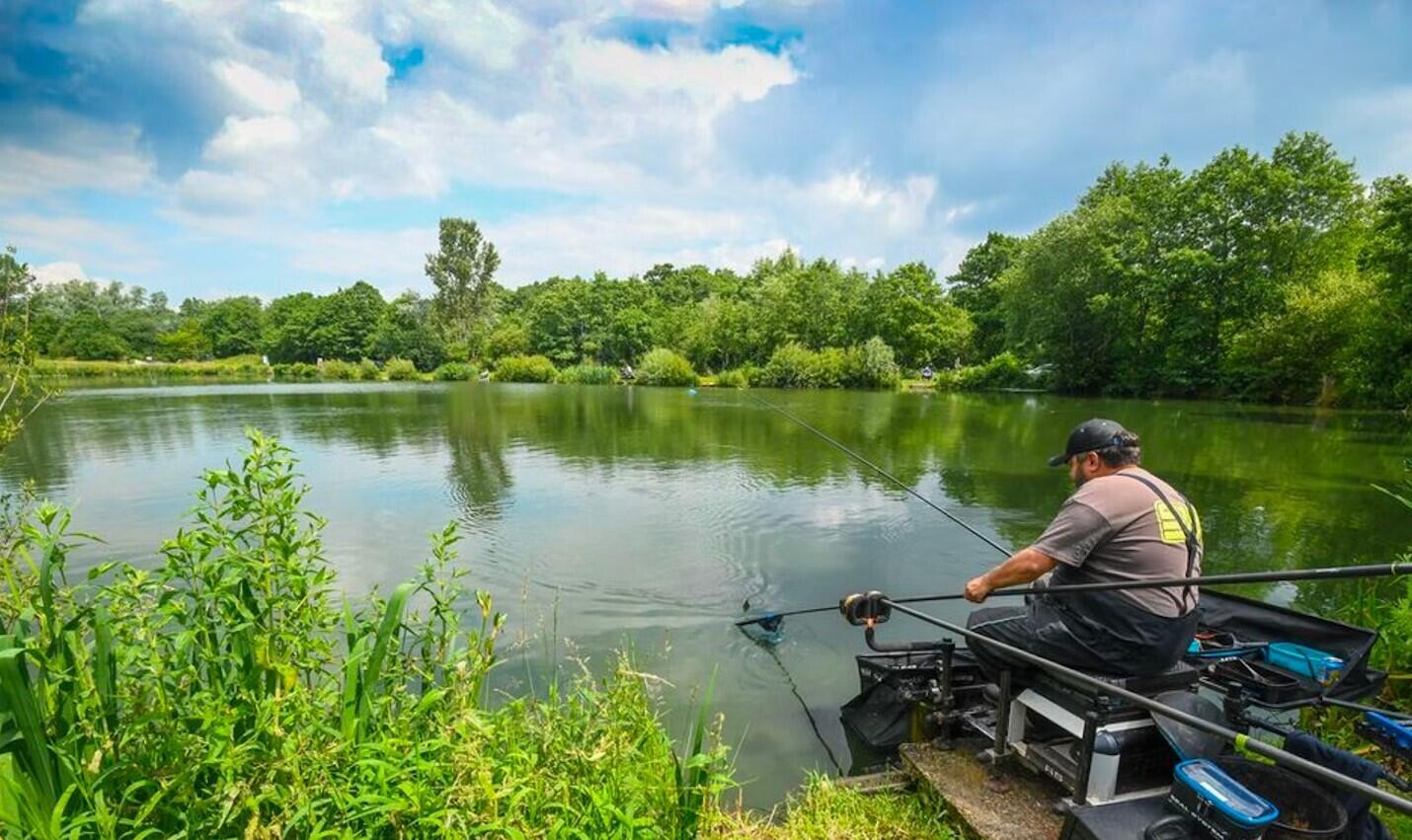509 Lenore Avenue Interlachen, FL 32148 - Photo 5 of 10 a lake view with a wooden fence and lake