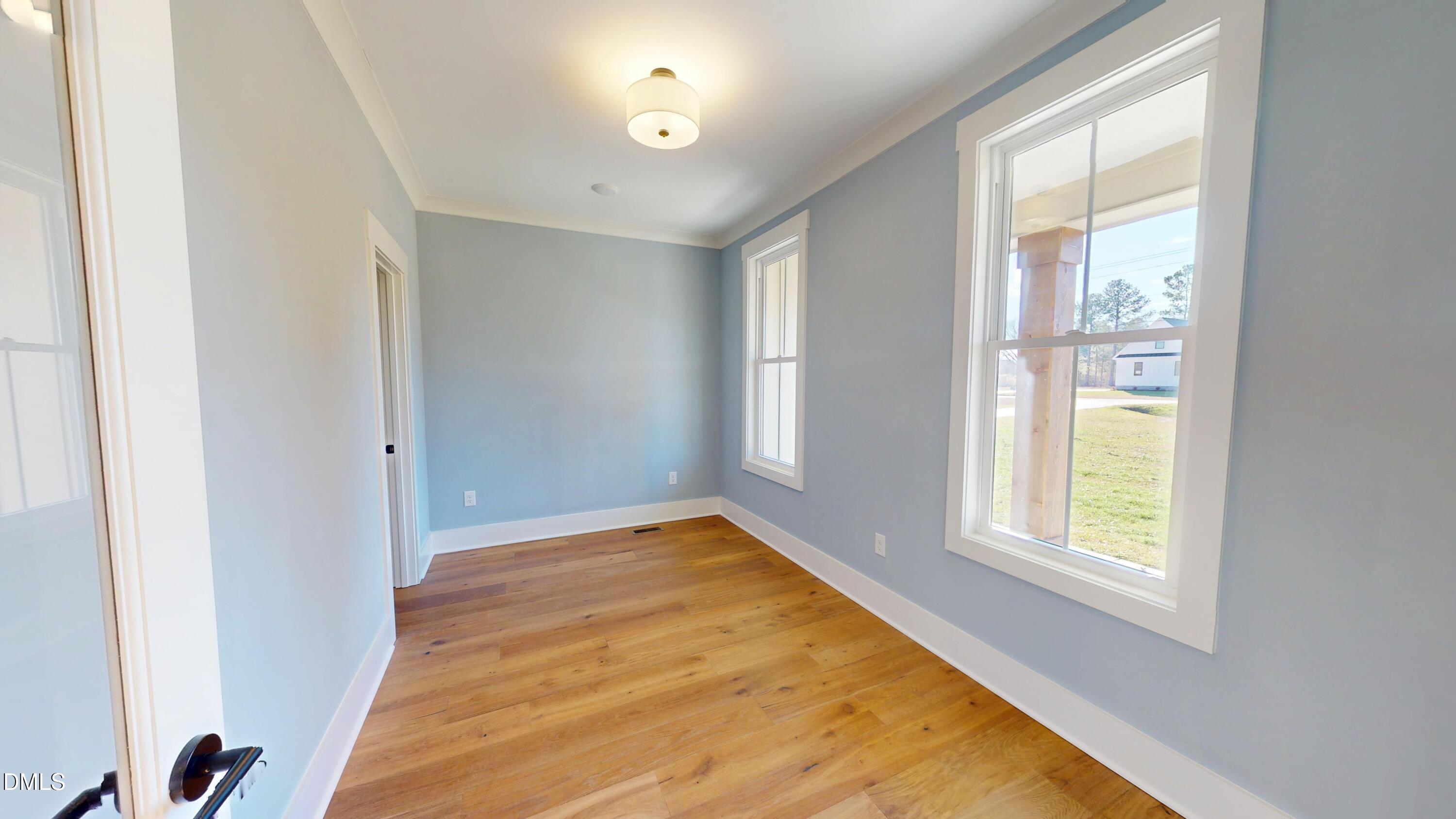 5008 Hopkins Chapel Road Zebulon, NC 27597 - Photo 23 of 32 a view of an empty room with a window