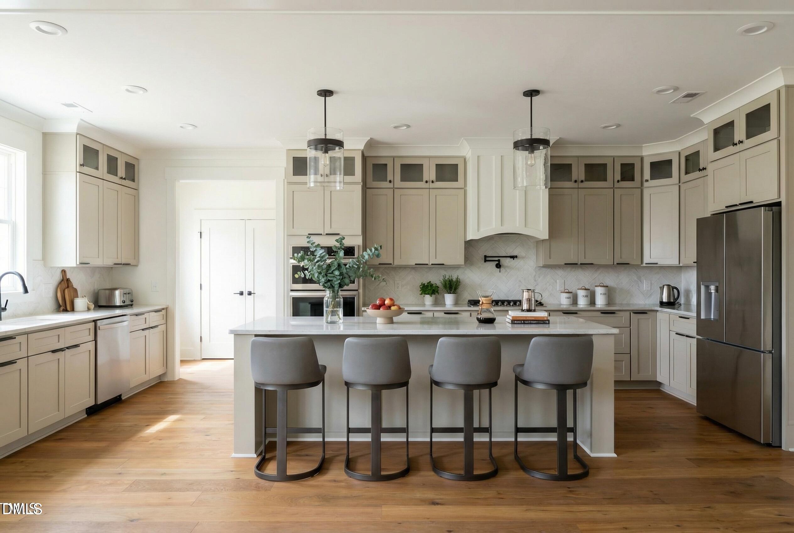 5008 Hopkins Chapel Road Zebulon, NC 27597 - Photo 7 of 32 a kitchen with a sink and chairs