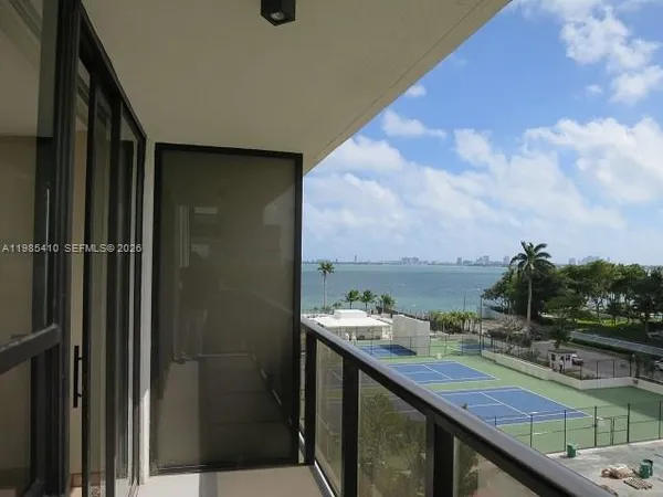 a view of swimming pool from a balcony