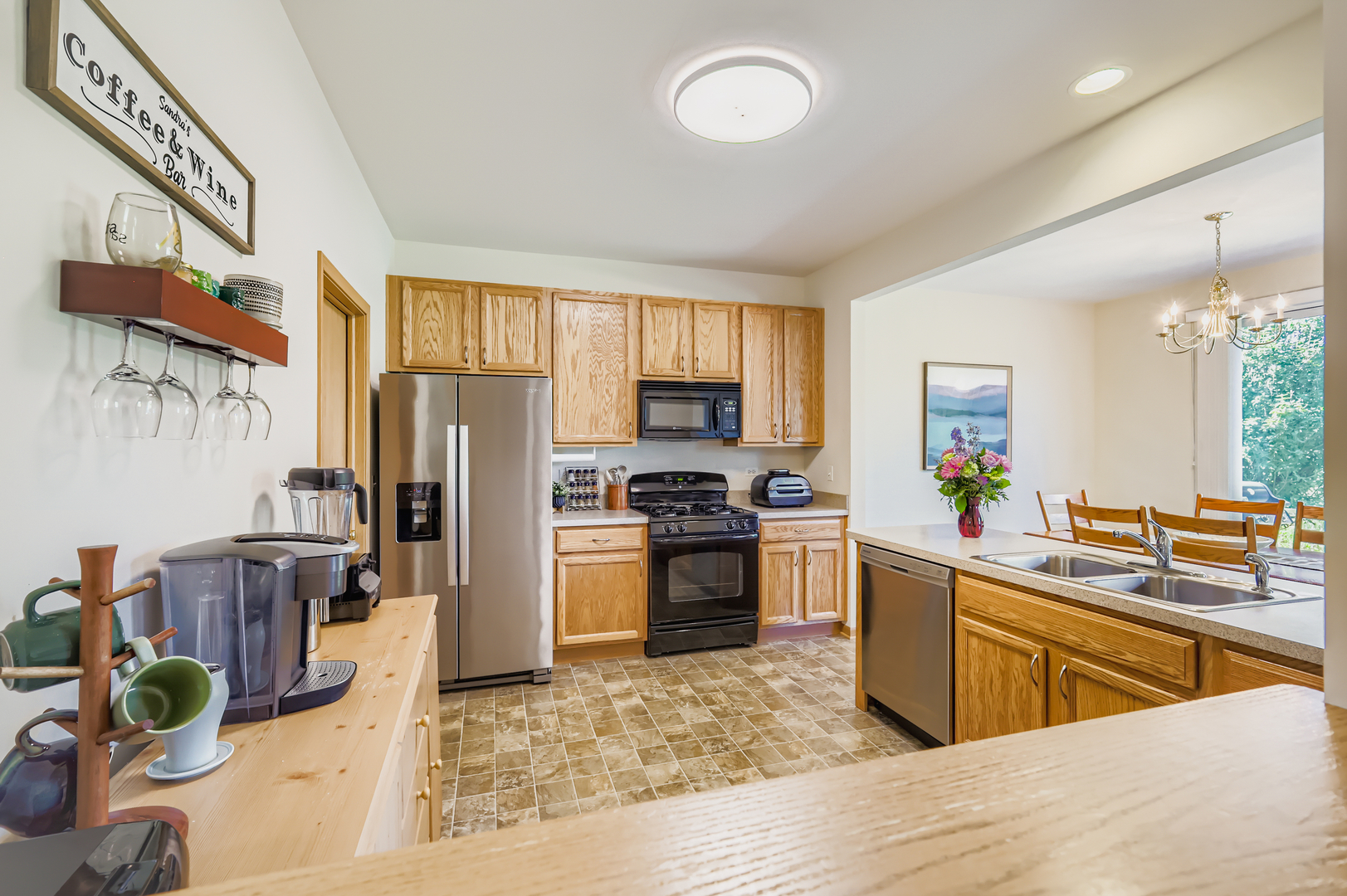 1409 Draper Road McHenry, IL 60050 - Photo 4 of 28 a kitchen with stainless steel appliances granite countertop a refrigerator a sink dishwasher stove and oven