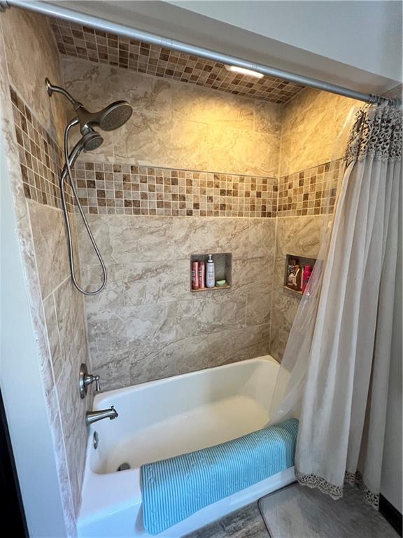 248 Ruth Street Pittsburgh, PA 15211 - Photo 15 of 24 a bathroom with a bathtub and a shower