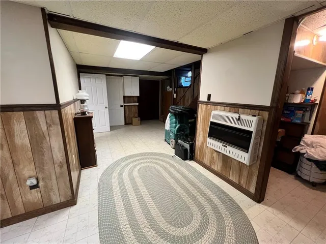 a view of a livingroom with furniture and a fireplace