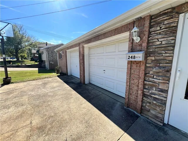 a view of a house with a backyard
