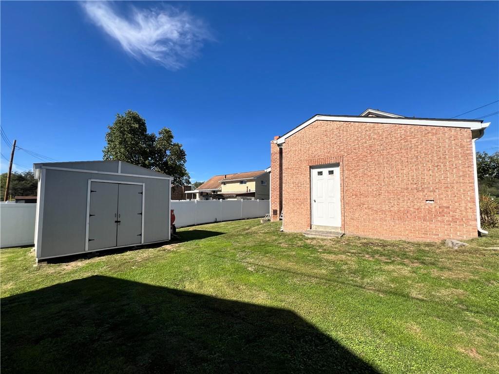 248 Ruth Street Pittsburgh, PA 15211 - Photo 23 of 24 a view of a house with backyard and garden