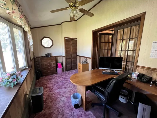 a workspace with furniture and wooden floor