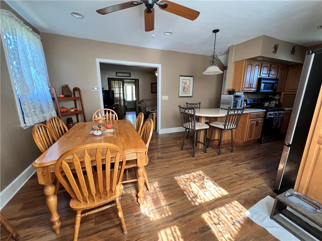 248 Ruth Street Pittsburgh, PA 15211 - Photo 9 of 24 a view of a dining room with furniture window and wooden floor