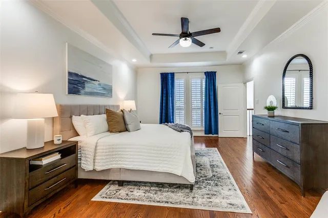 a bedroom with a large bed and a dresser