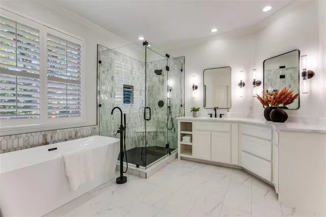 a bathroom with a double vanity sink mirror and shower