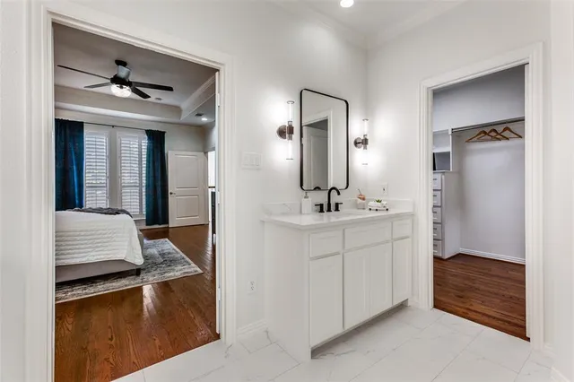 a en suite bathroom with a sink and mirror