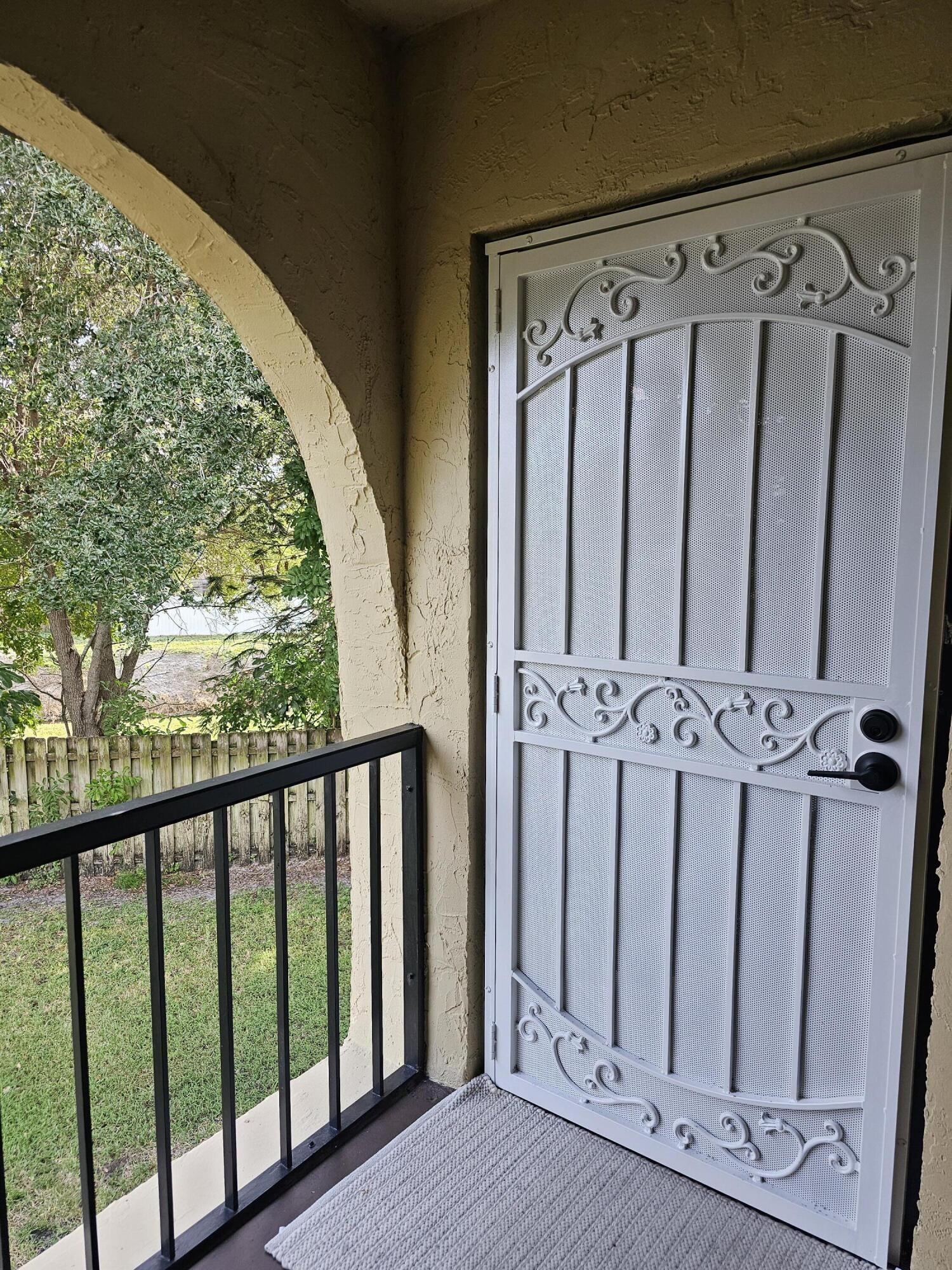 312 Pine Ridge Circle, Unit A2 Greenacres, FL 33463 - Photo 43 of 62 Terrace door