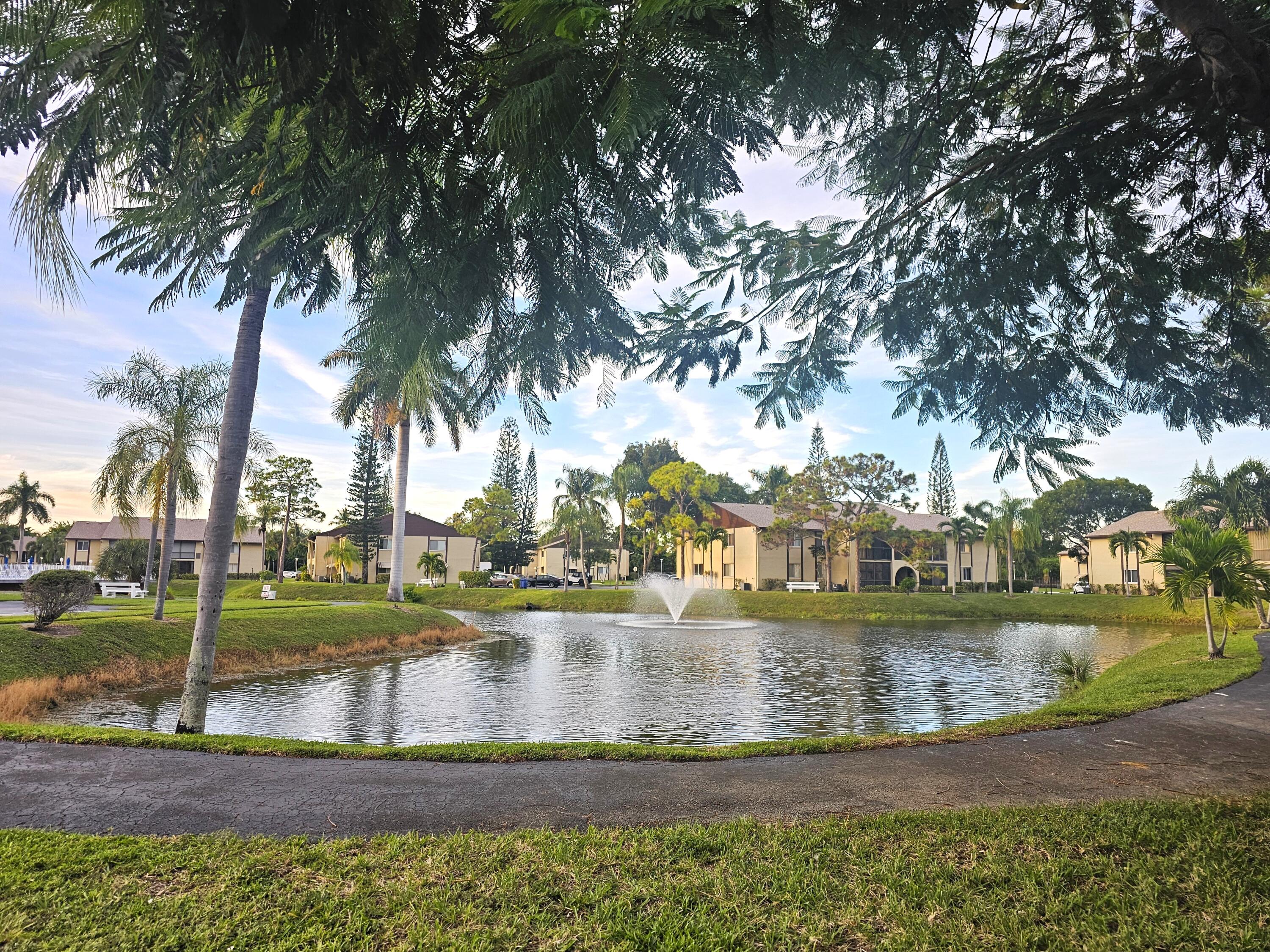 312 Pine Ridge Circle, Unit A2 Greenacres, FL 33463 - Photo 47 of 62 lake walking