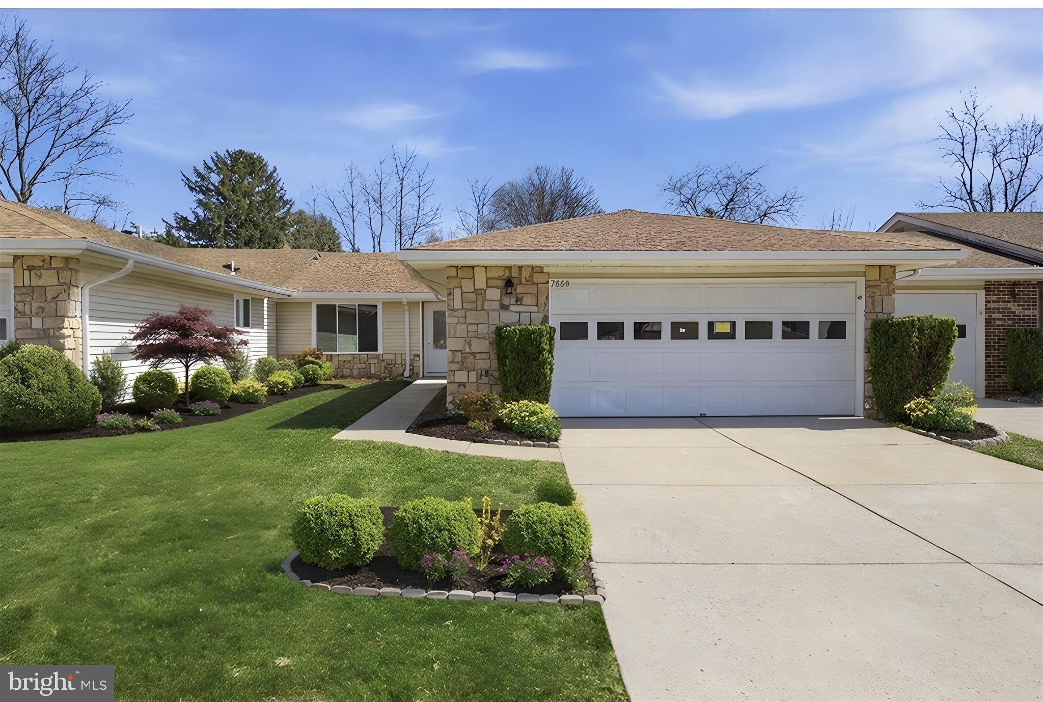 a view of a house with garden and yard