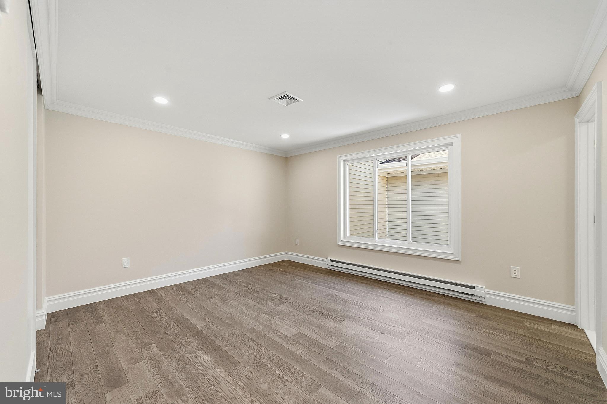 780 Ardmore Road Monroe Township, NJ 08831 - Photo 15 of 30 a view of empty room with wooden floor and fan