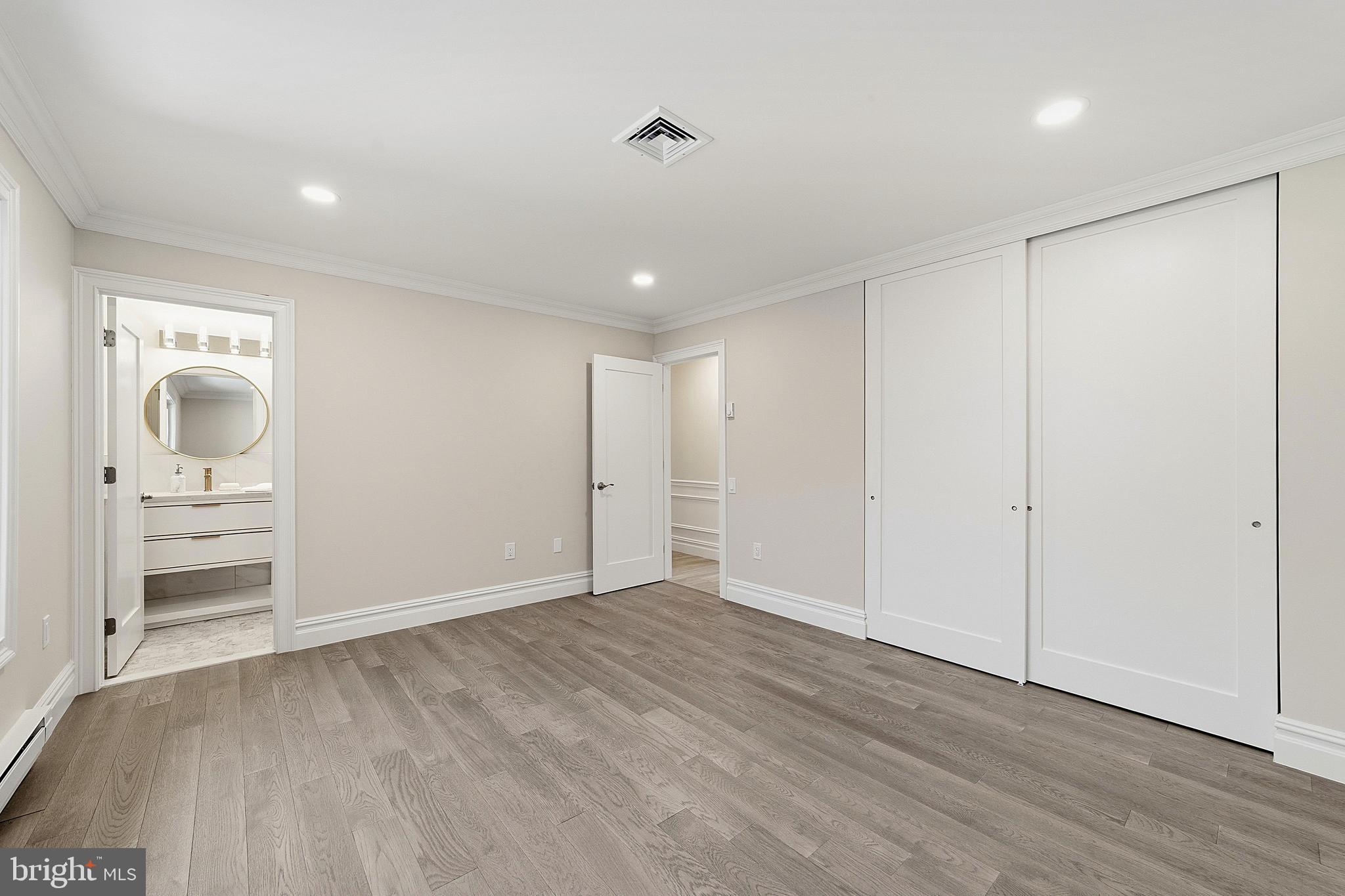 780 Ardmore Road Monroe Township, NJ 08831 - Photo 16 of 30 wooden floor in an empty room with a window