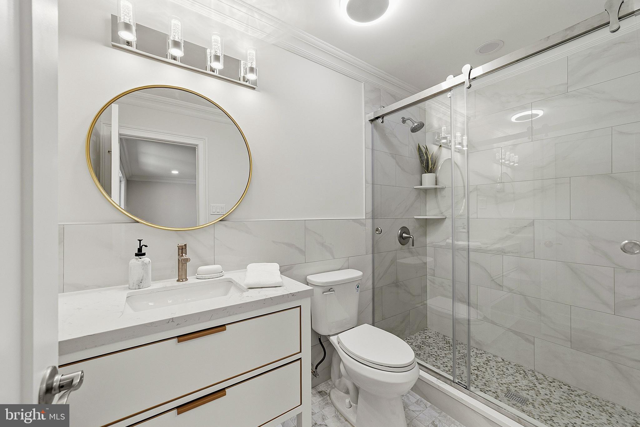 780 Ardmore Road Monroe Township, NJ 08831 - Photo 17 of 30 a bathroom with a toilet sink vanity granite and a mirror