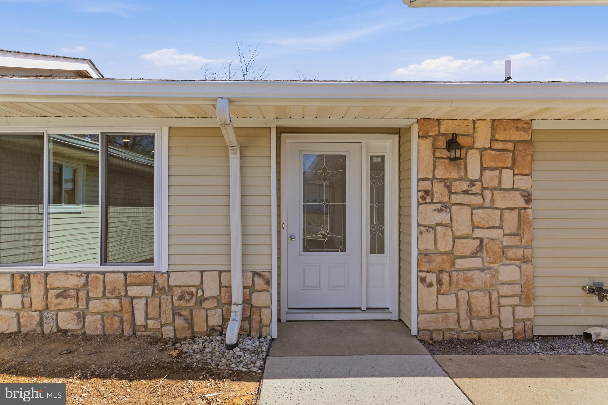 780 Ardmore Road Monroe Township, NJ 08831 - Photo 2 of 30 a view of a brick house with a glass door