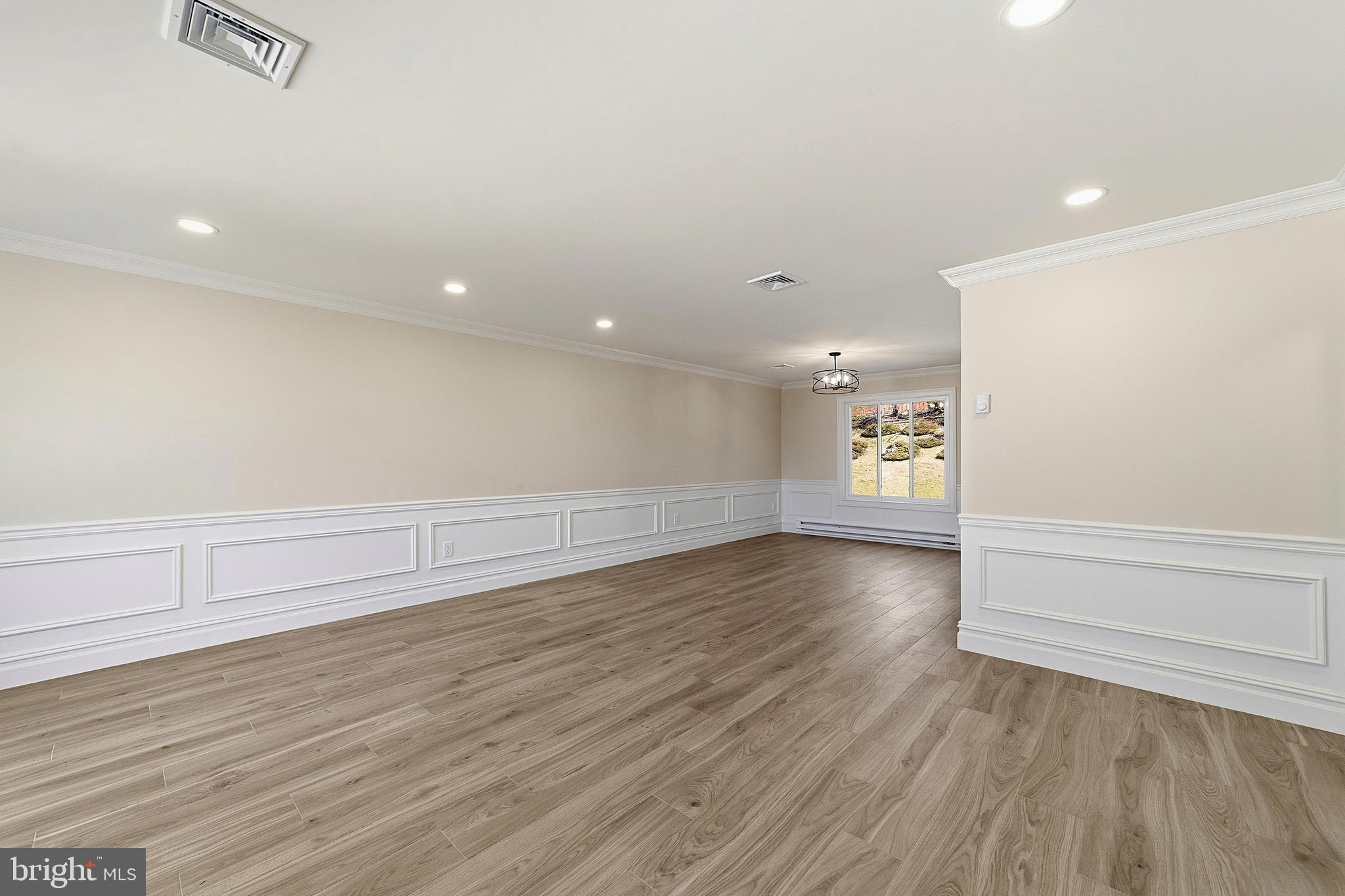 780 Ardmore Road Monroe Township, NJ 08831 - Photo 3 of 30 wooden floor in an empty room with a window