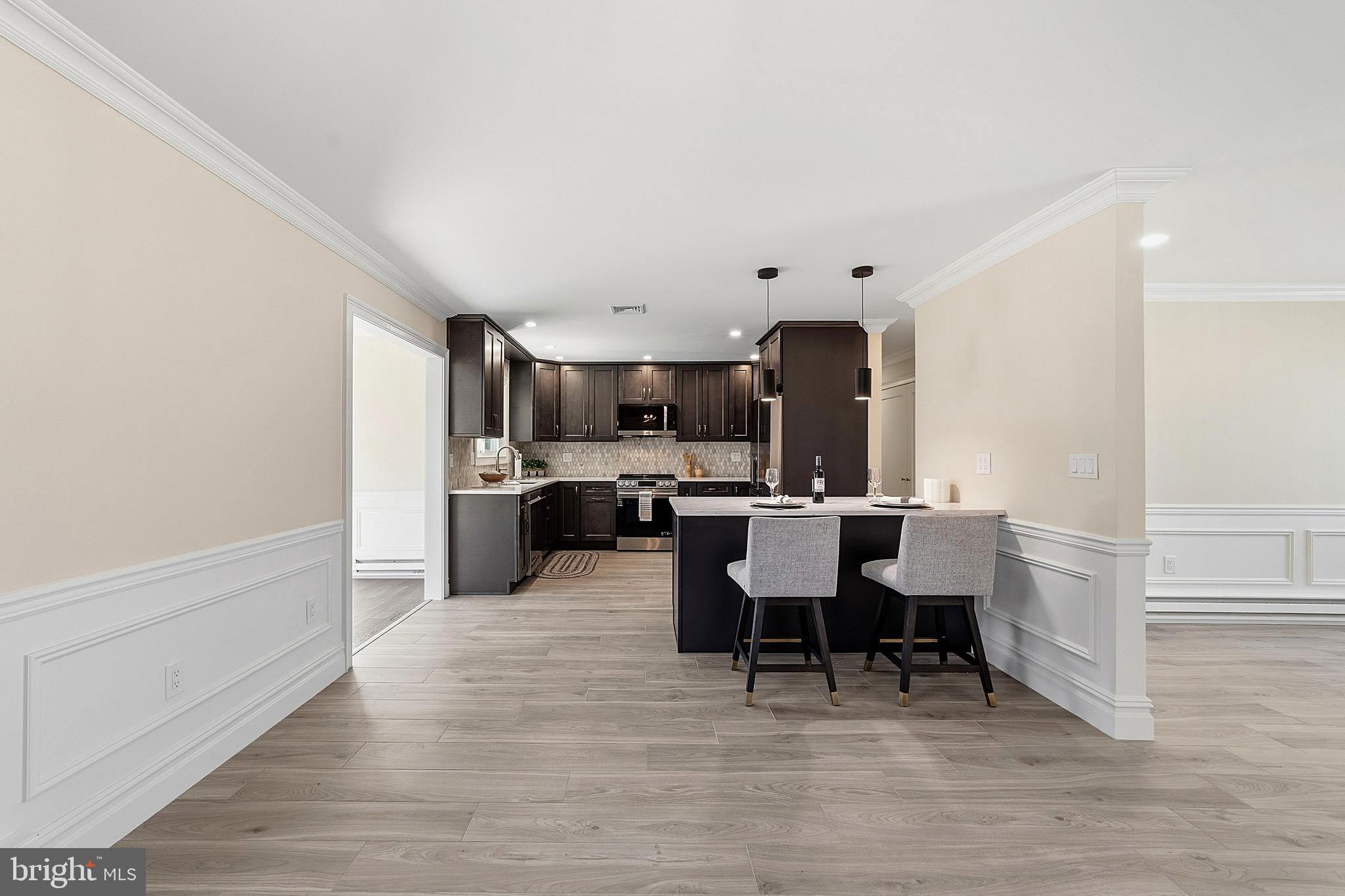 780 Ardmore Road Monroe Township, NJ 08831 - Photo 6 of 30 a view of a dining room with furniture and wooden floor