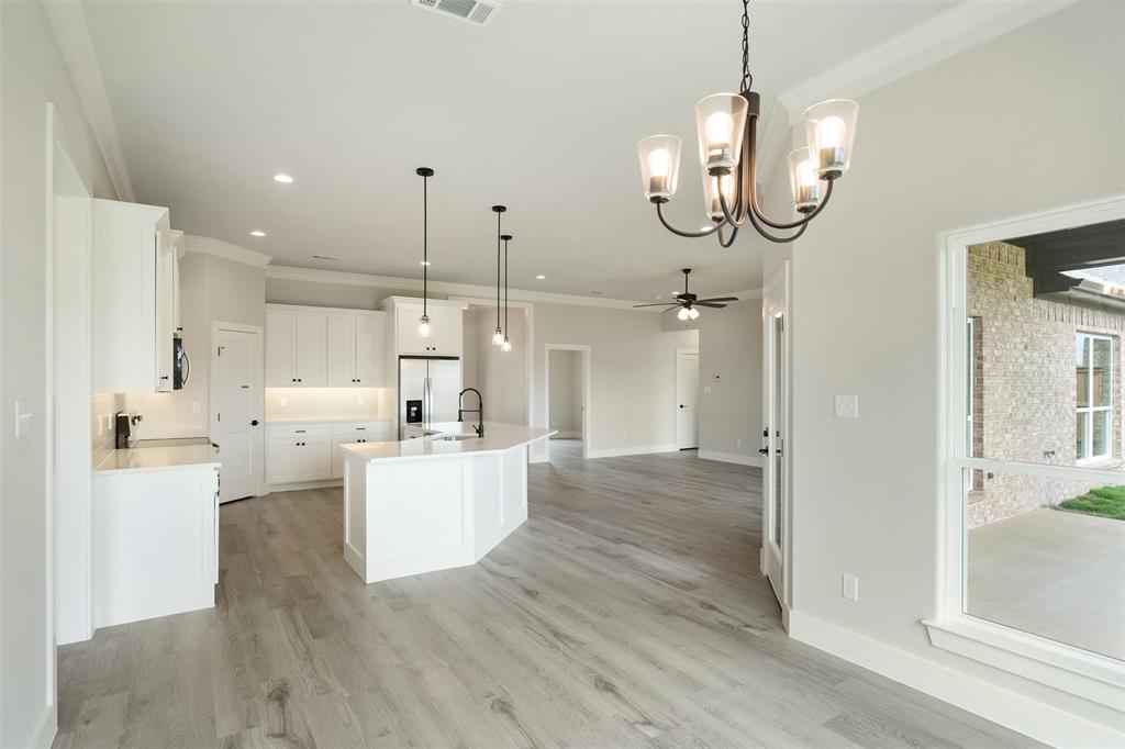 509 Limestone Circle Mabank, TX 75147 - Photo 15 of 36 a view of a kitchen and a chandelier