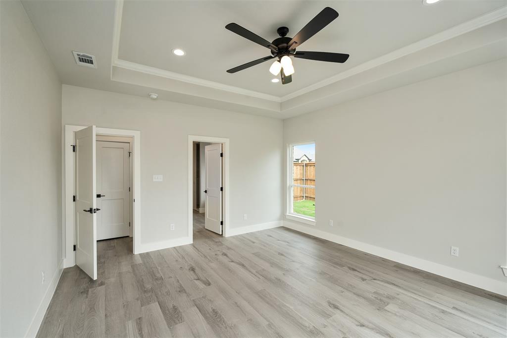 509 Limestone Circle Mabank, TX 75147 - Photo 16 of 36 wooden floor in an empty room with a window