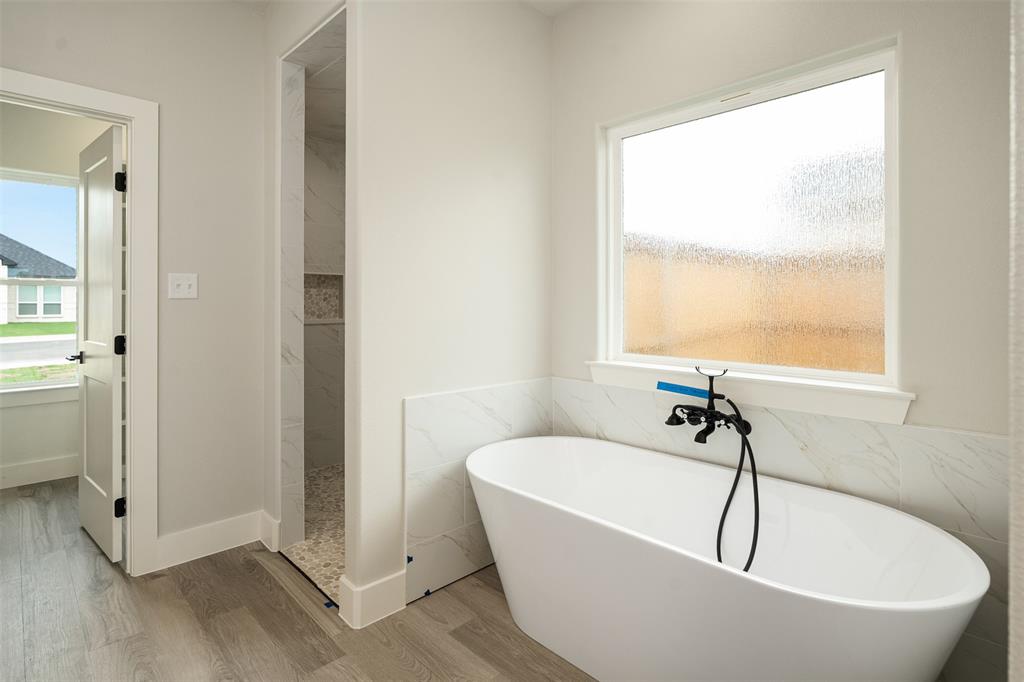 509 Limestone Circle Mabank, TX 75147 - Photo 19 of 36 a white bath tub sitting next to a window