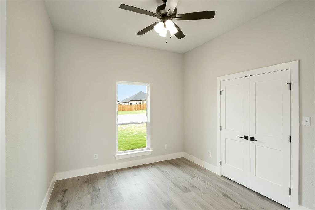 509 Limestone Circle Mabank, TX 75147 - Photo 27 of 36 a view of empty room with wooden floor and fan