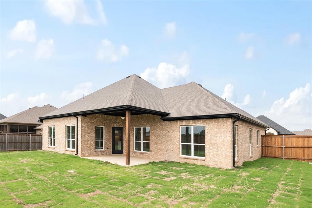 509 Limestone Circle Mabank, TX 75147 - Photo 30 of 36 a view of a house with a yard and porch