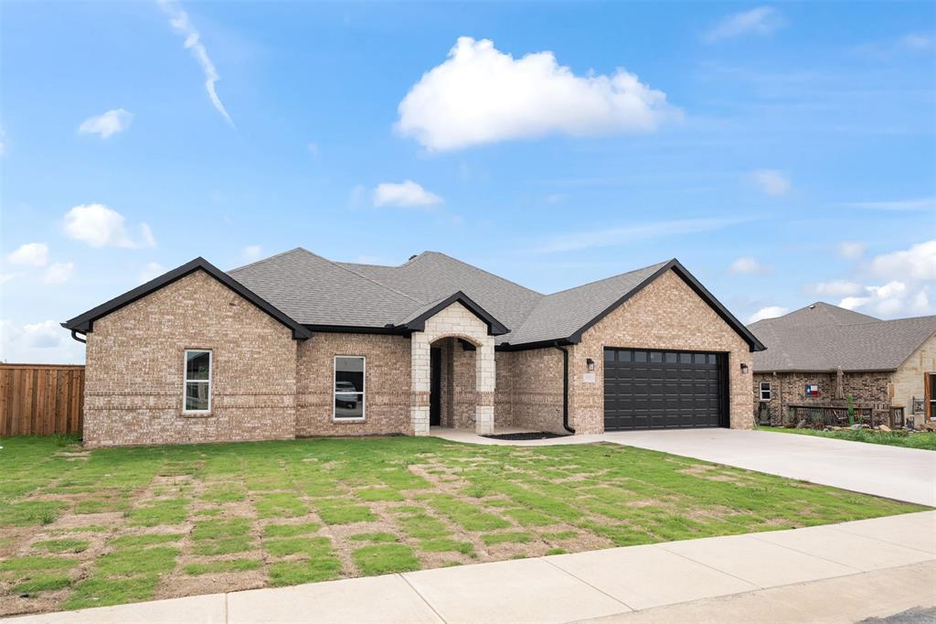509 Limestone Circle Mabank, TX 75147 - Photo 33 of 36 a backyard of a house with barbeque oven and outdoor seating