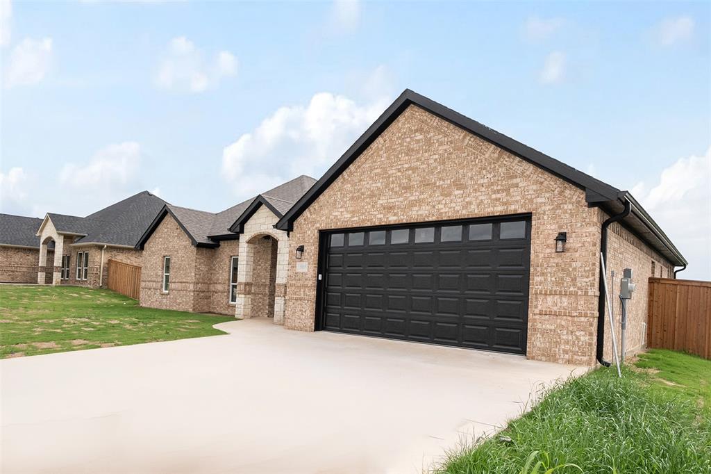 509 Limestone Circle Mabank, TX 75147 - Photo 34 of 36 a front view of a house with a yard and garage