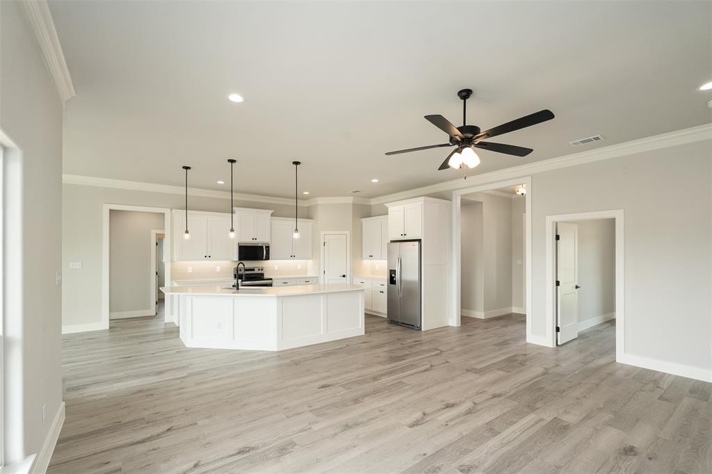 509 Limestone Circle Mabank, TX 75147 - Photo 6 of 36 a view of kitchen with stainless steel appliances refrigerator stove microwave and cabinets