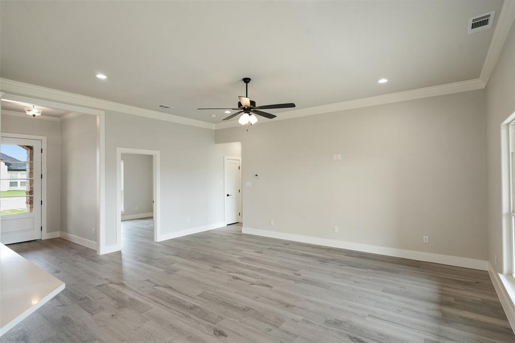 509 Limestone Circle Mabank, TX 75147 - Photo 7 of 36 wooden floor in an empty room with a window