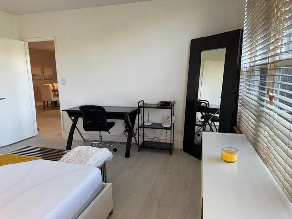 a reading room with furniture and a window