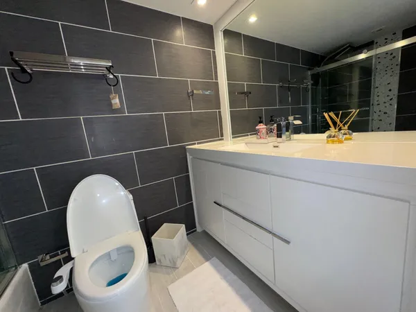 a bathroom with a sink and mirror