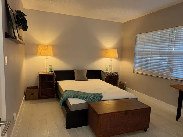 a room with bed and window