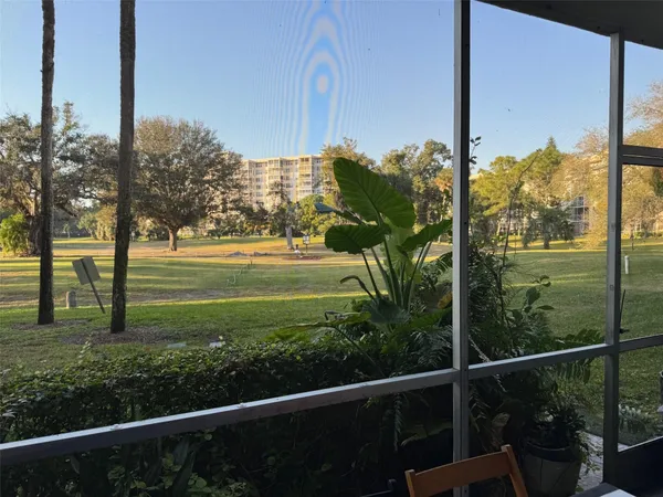 a view of a balcony with chairs
