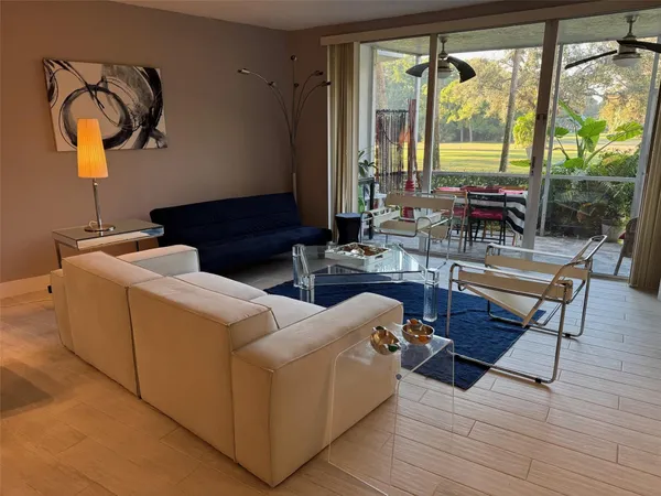 a living room with furniture and a window