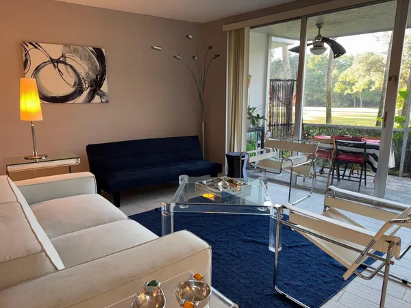 a living room with furniture and a window