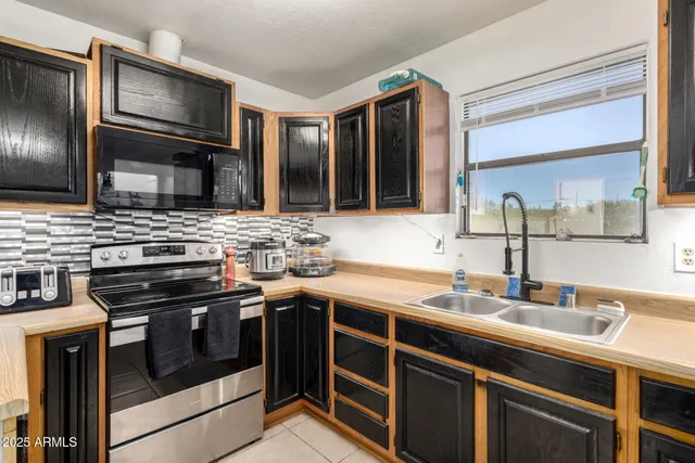 a living room with furniture and a mirror