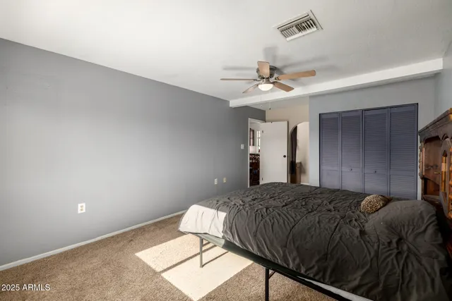 a bedroom with a bed and window