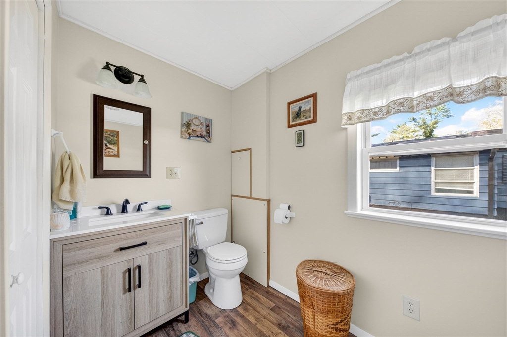 19 Timber Lane Wareham, MA 02571 - Photo 18 of 38 a bathroom with a toilet a sink and mirror