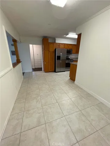 a view of a livingroom with furniture and a window