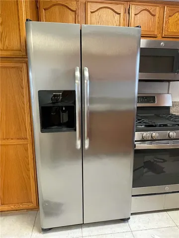 a close view of a stove kitchen and utility room