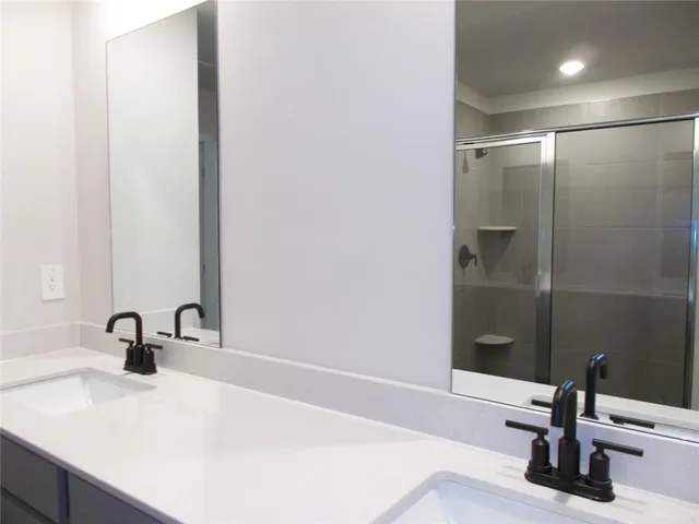 a close view of a sink and a vanity in the bathroom