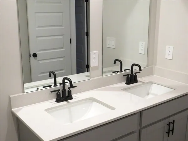 a close view of a sink and a vanity in the bathroom