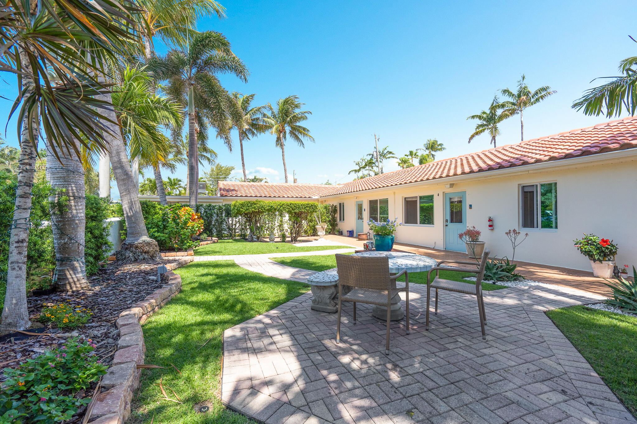 11 Tropical Drive, Unit 2 Ocean Ridge, FL 33435 - Photo 5 of 12 a view of a house with a yard and sitting area