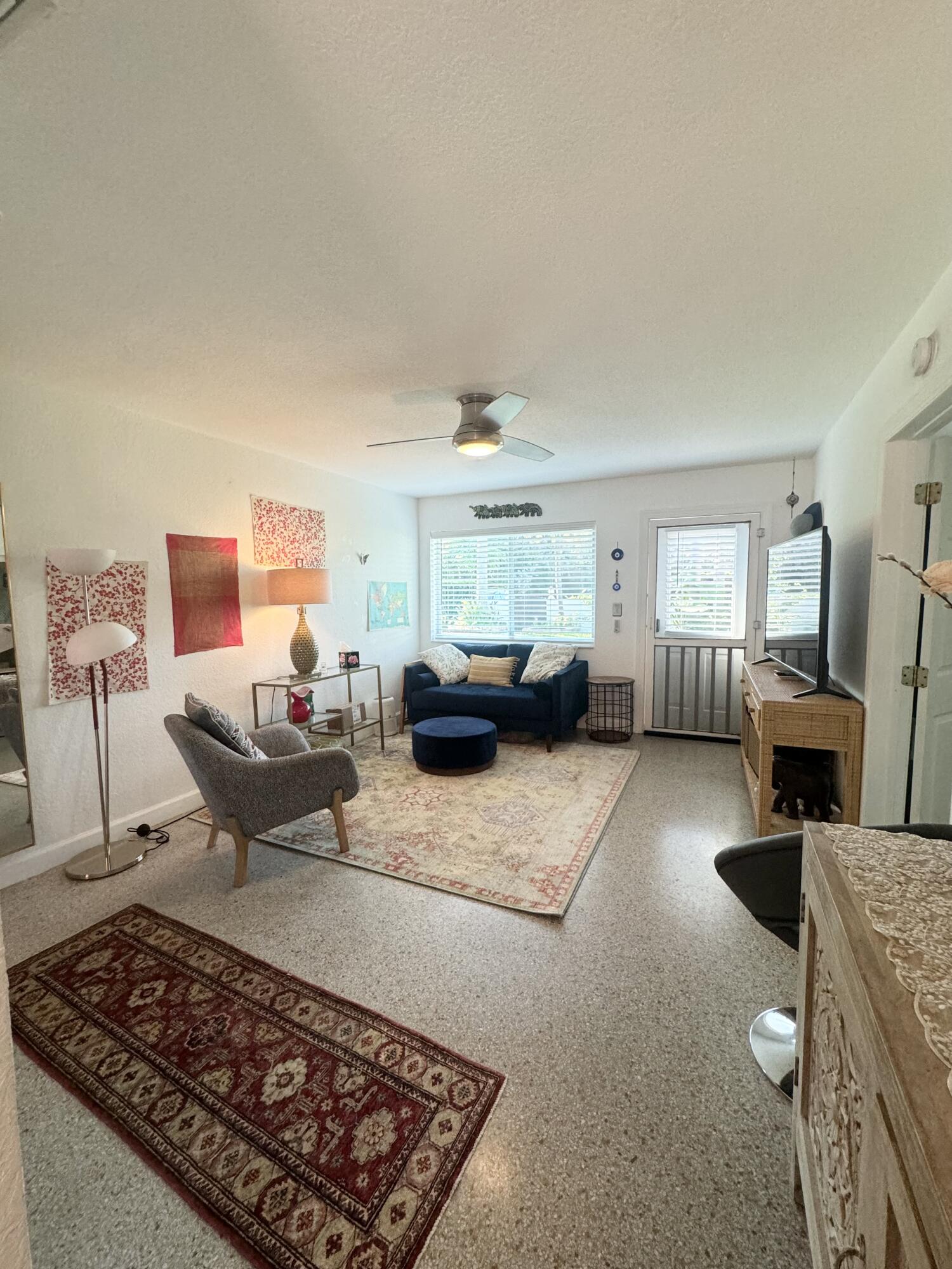 11 Tropical Drive, Unit 2 Ocean Ridge, FL 33435 - Photo 8 of 12 a living room with furniture rug and window