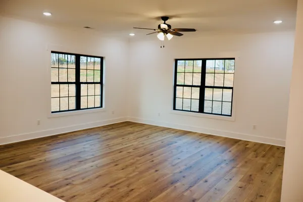 a hallway with table and chairs