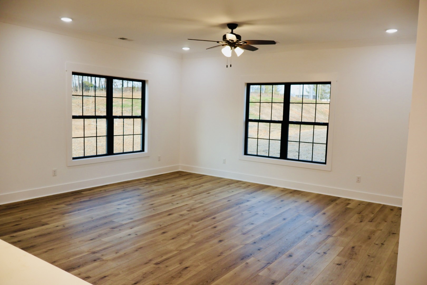 62 Hall Street Lexington, TN 38351 - Photo 12 of 48 wooden floor in an empty room with a window