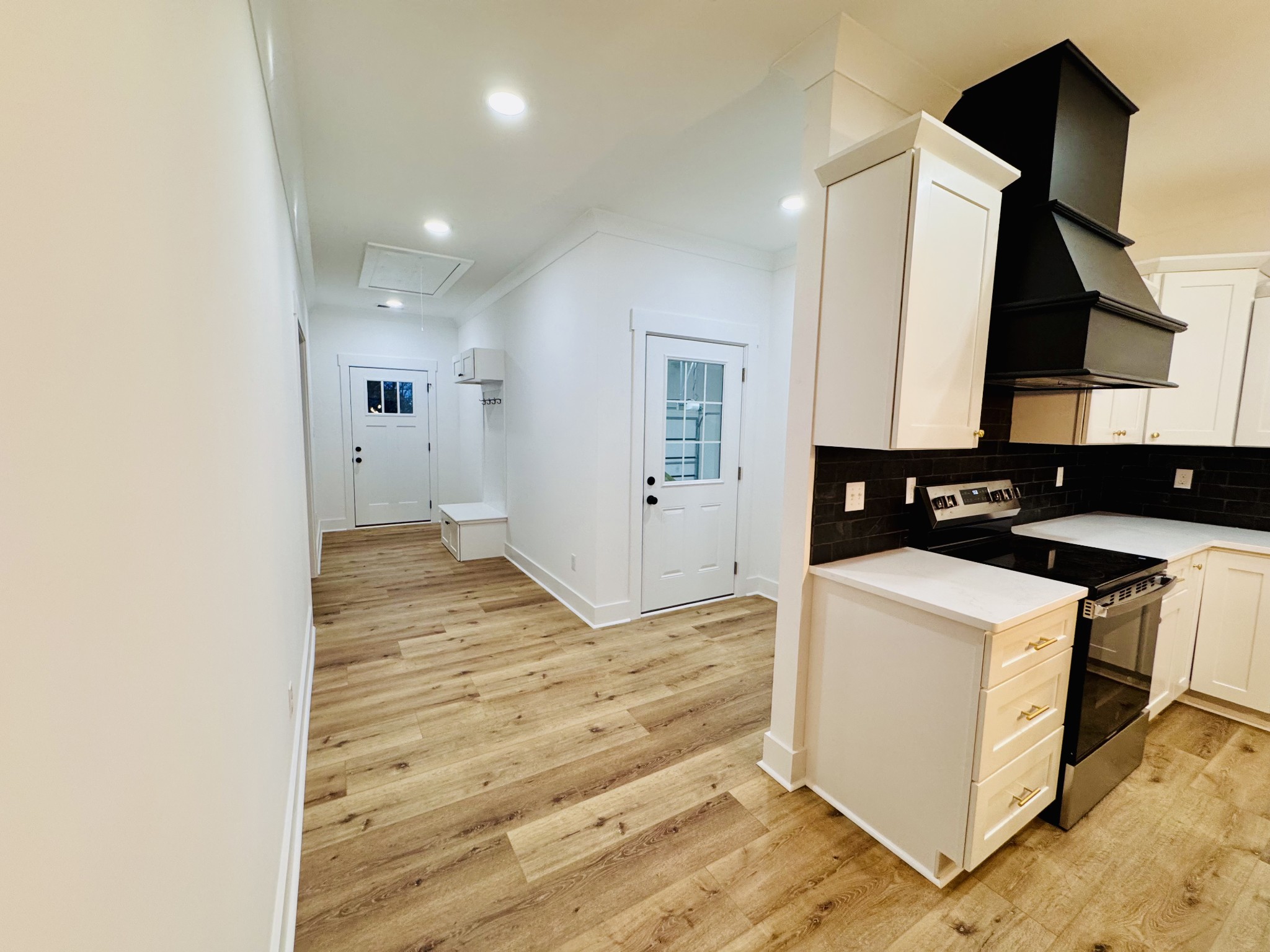 62 Hall Street Lexington, TN 38351 - Photo 44 of 48 a view of a kitchen with white cabinets and wooden floor